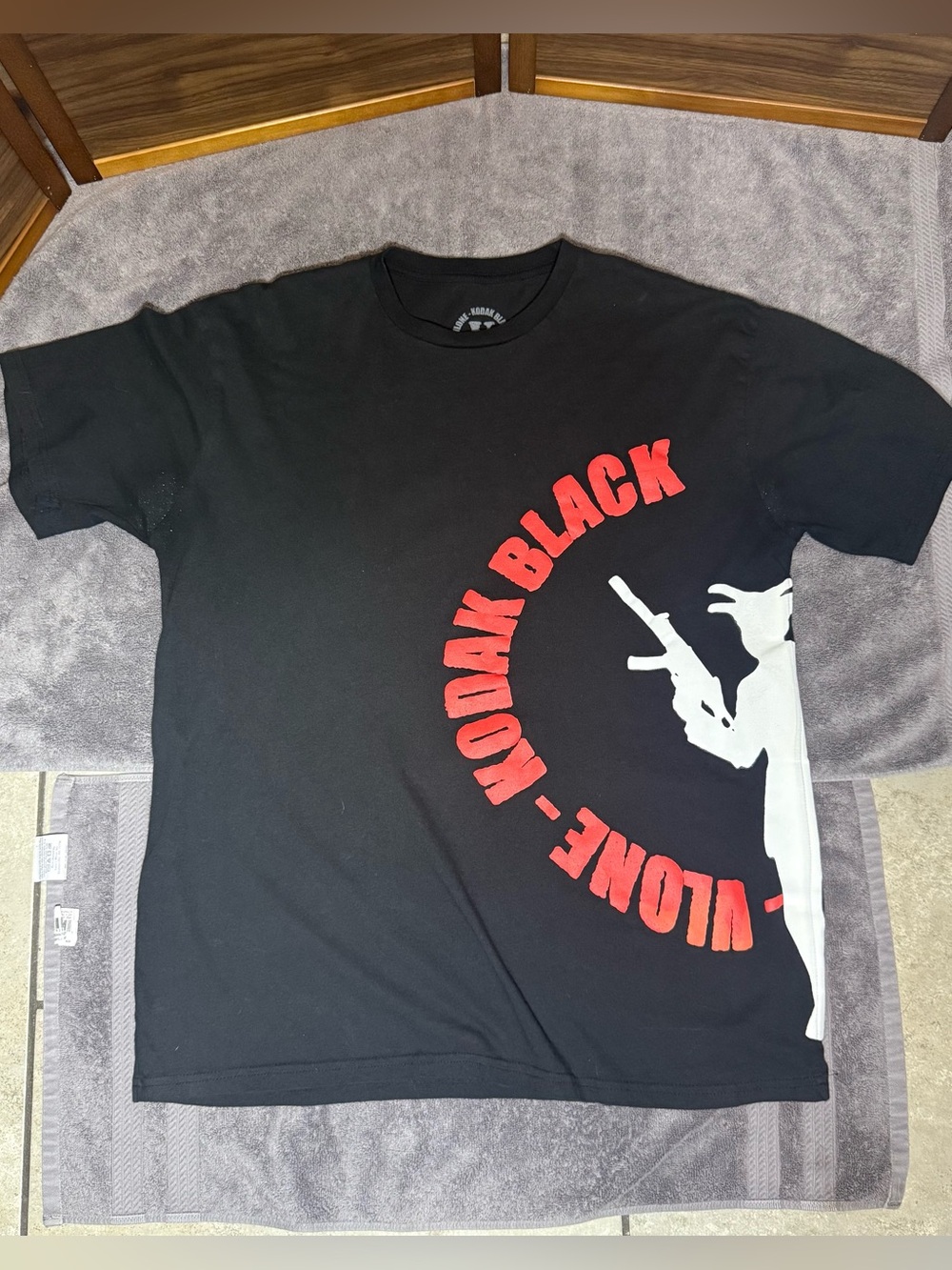 VLONE Black Tee with Red Arc Logo and White Silhouette🌟